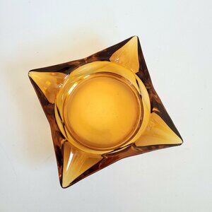 Vintage mid century yellow amber glass ashtray.